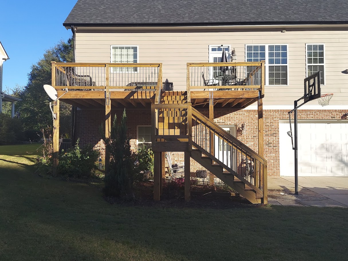 Custom two-tier wood deck with staircase built by Hamilton Helping Hands LLC in metro Atlanta